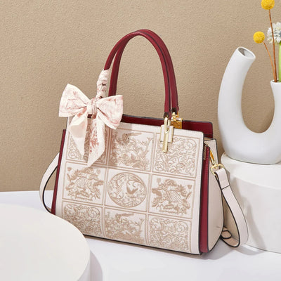 Sylvia™ – Výjimečná crossbody taška s výšivkou a mašlí